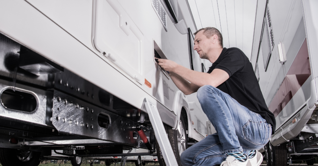 An image of a technician repairing an RV.